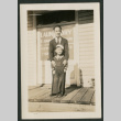 Man and child in front of dry cleaners (ddr-densho-359-125)