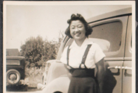 Florence Maeda standing next to car (ddr-densho-493-159)