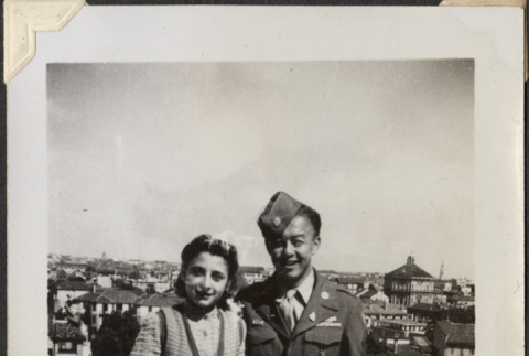 Man and woman standing on rooftop (ddr-densho-466-830)