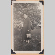 Photo of an elderly woman with a tree (ddr-densho-483-471)