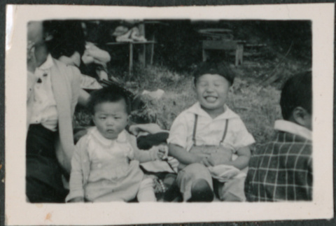 Two children at a picnic (ddr-densho-523-109)