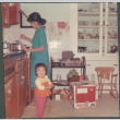 Woman and child in kitchen (ddr-densho-523-504)