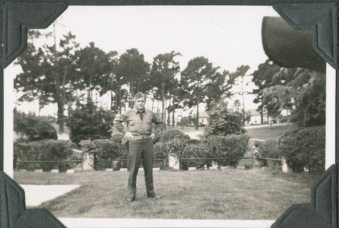 Man in uniform standing in yard (ddr-ajah-2-118)