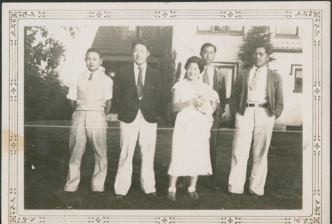 Four men and a women standing on lawn outside house (ddr-densho-316-279)