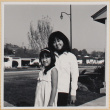 Two girls outside house (ddr-densho-522-126)