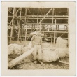 Photograph of an unknown man standing in front of a construction site (ddr-densho-329-285)
