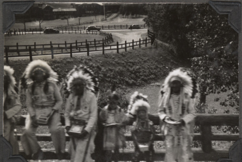 Group of men and two children in Native American costumes (ddr-densho-466-187)