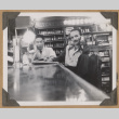 Gary and another man sitting at a counter (ddr-densho-542-66)