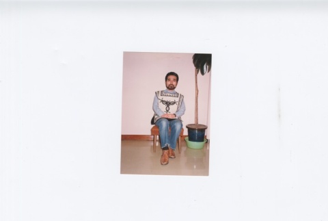 (Photograph) - Image of man sitting on chair (ddr-densho-330-290-master-3186a210db)