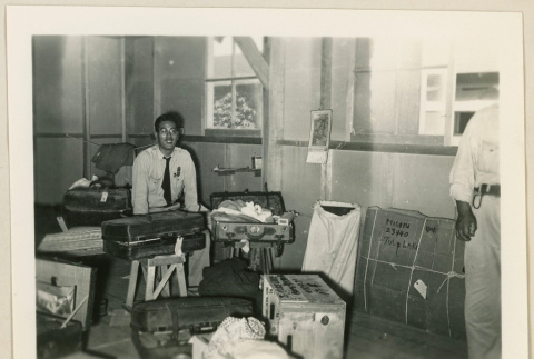 Worker at baggage inspection (ddr-densho-37-886)