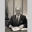 Man sitting at his desk (ddr-njpa-2-373)