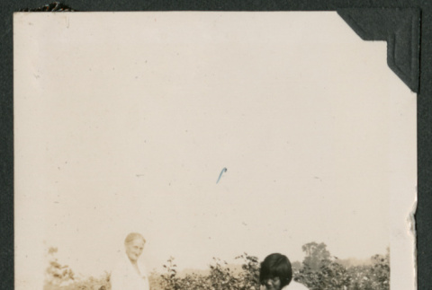 girl and woman in garden (ddr-densho-378-674)