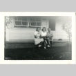 Three women sitting on a porch (ddr-manz-7-125)