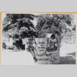 Leslie and Susan Shiomi behind novelty sign (ddr-densho-522-588)