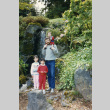 Family in front of a waterfall in the Garden (man and 3 children) [family] (ddr-densho-354-606)