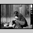 Man and child petting dog (ddr-densho-475-130)