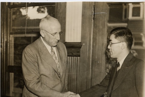 Lester Petrie shaking hands with another man (ddr-njpa-2-810)