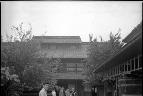 Group standing in courtyard outside workshop (ddr-densho-426-2477)