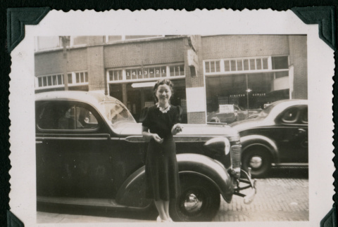 Woman poses in front of car (ddr-densho-359-1063)