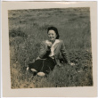 Woman sitting in field (ddr-densho-426-1938)