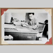 Man reads at desk (ddr-densho-404-405)