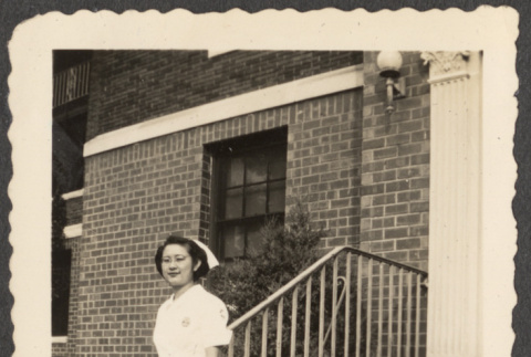 Nurse standing on steps (ddr-densho-433-1025)