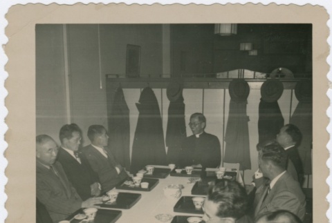 Men in suits seated at table drinking tea (ddr-densho-330-278)