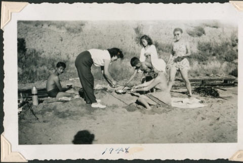 Group cooking on the beach (ddr-densho-321-169)