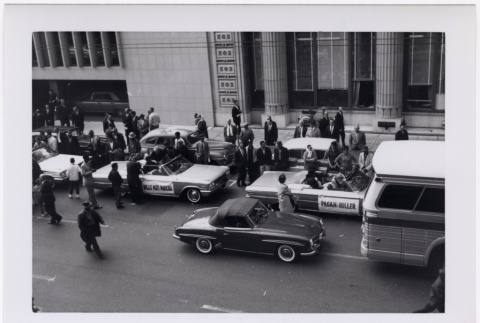 Black and white photo of cars in parade (ddr-densho-426-13)