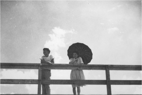 Two Nisei on a bridge (ddr-densho-167-16)