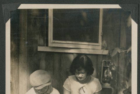 two kids sitting on crate (ddr-densho-378-480)