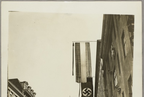Nazi flags flying over a street (ddr-njpa-13-1599)