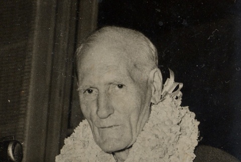 Man wearing leis (ddr-njpa-2-80)