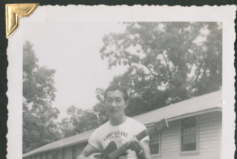 Man playing guitar (ddr-densho-434-249)