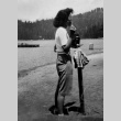 June Kitagawa standing on the lakefront (ddr-densho-336-1)