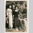Tomoye (Nozawa) Takahashi and two unidentified women standing in garden (ddr-densho-426-2146)