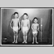 Tsukada brothers measuring their height (ddr-densho-443-85)