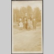 Issei man and children at train station (ddr-densho-259-195)