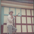 Agnes Sakura painting garage trim (ddr-densho-523-325)