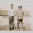 Two men standing (ddr-janm-17-57)