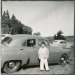 Chester Sakura Jr standing next to car (ddr-densho-523-208)