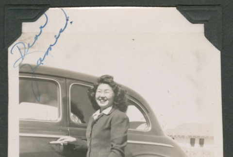 Pat poses next to a car (ddr-densho-463-78)