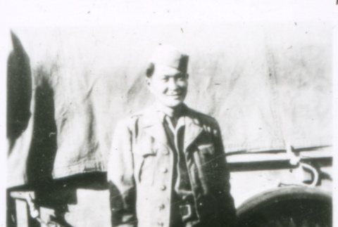 Soldier in front of truck (ddr-densho-1007-771)