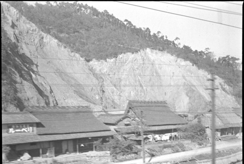 Photo of buildings, taken from train (ddr-densho-426-298)