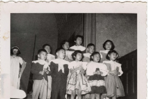 Children singing for Christmas performance at Christian Fellowship Church (ddr-densho-409-23)