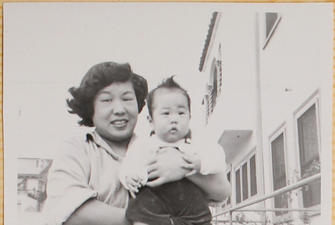 Yoshiko Shiomi holding Susan Shiomi (ddr-densho-522-156)