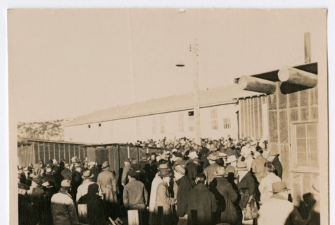Crowd of people in front of a large building (ddr-densho-223-4)