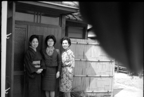 Tomoye (Nozawa) Takahashi with two unidentified woman outside house (ddr-densho-426-2346)