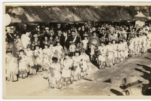 Adults and children line up for a procession (ddr-sbbt-4-14)