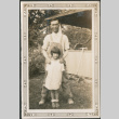 Man and girl outside house (ddr-densho-316-228)